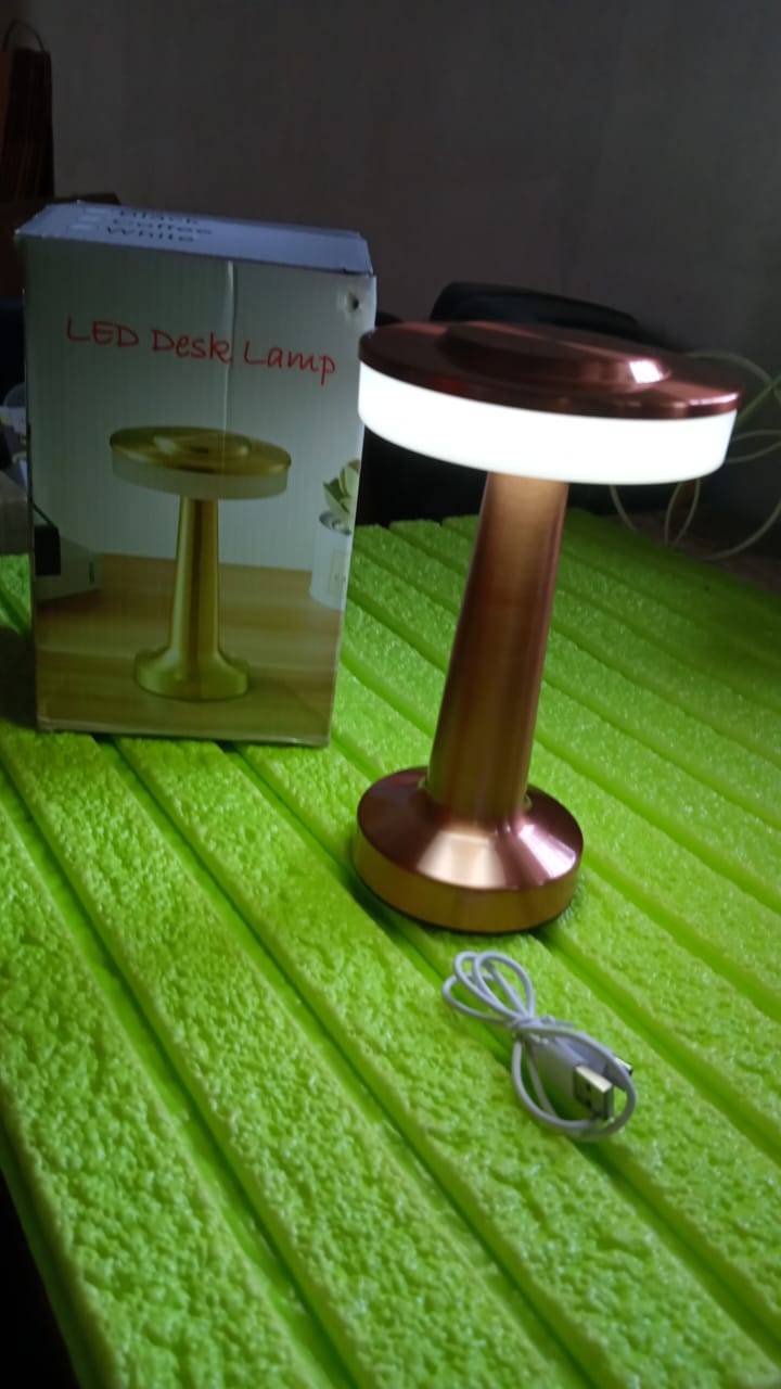 Modern LED desk lamp on a side table, ideal for home decor.
