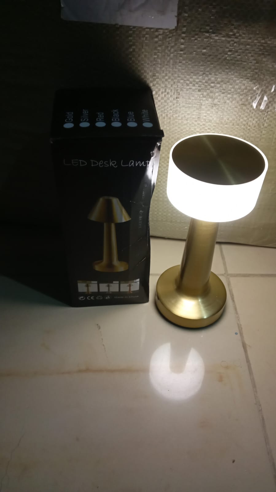 An alternative view of the modern metal LED table lamp from a different angle.